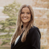 Woman smiling in suit 