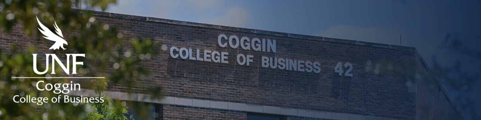 Coggin College of Business Building with blue gradient and UNF Coggin College of Business logo