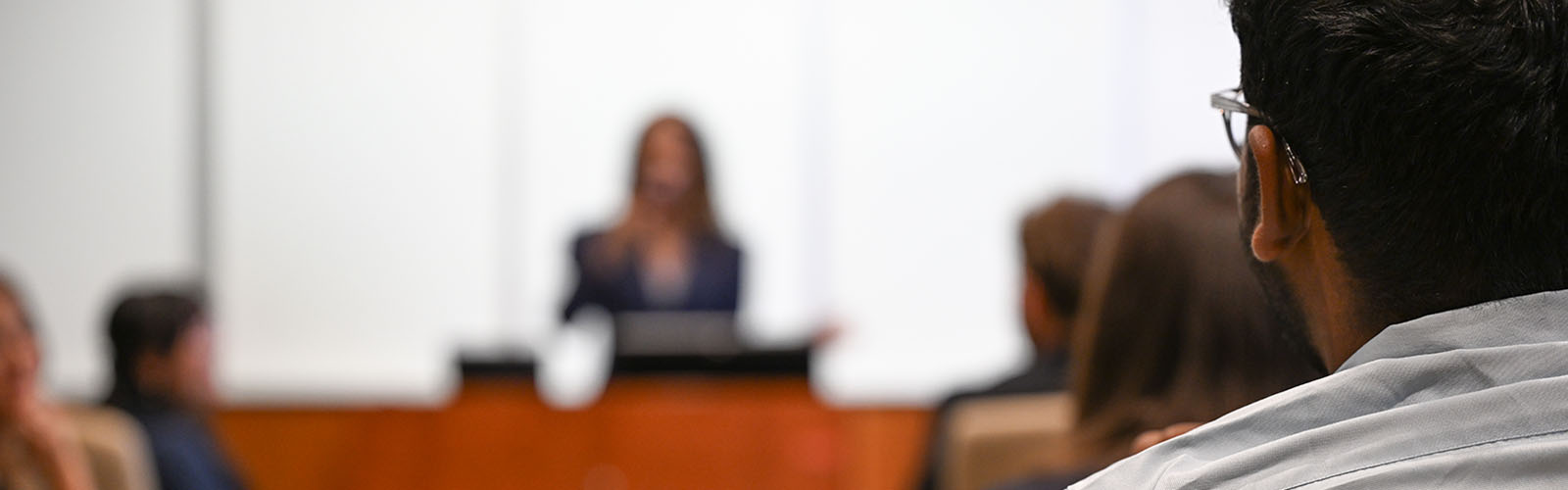 students watching an instructor in a classroom