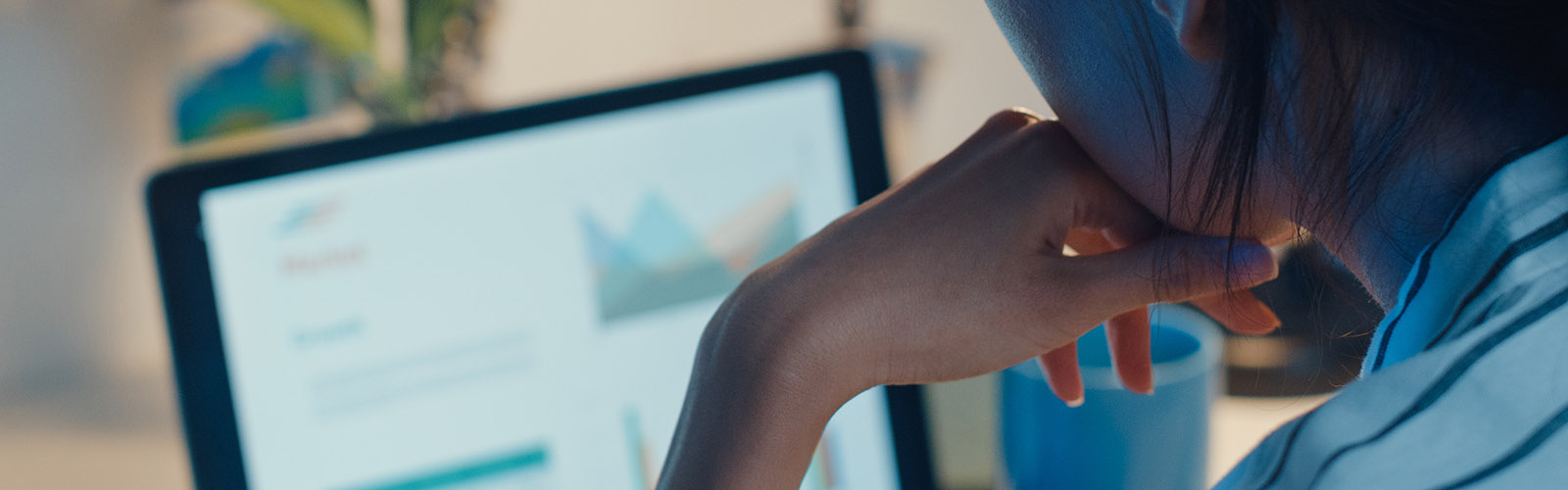 student studying economics on a computer