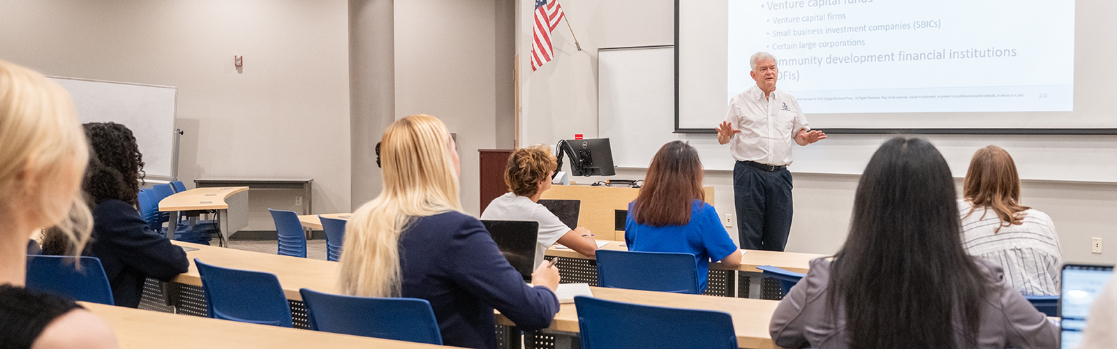 instructor leading a classroom of students