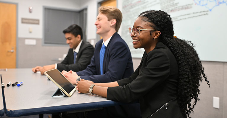 students practicing before the supply chain case competition