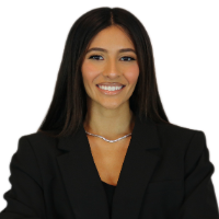 Headshot of Acsa, smiling with a plain white background.