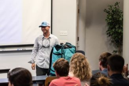 Steve Elder talking to a group of students