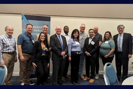 Group of people taking a group picture at the International business conference held at UNF