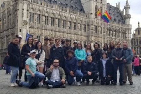 Group of exchange students in front of old building