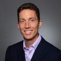 Headshot of Matt Nelson with a gray background. 