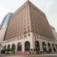 Picture of a brown building with many windows