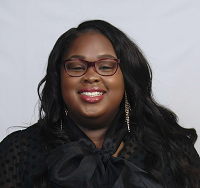 Headshot of Audrieanna Burgin with a black shirt with a white background