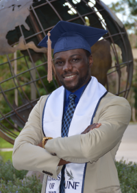 Photo of Giovanni standing and smiling