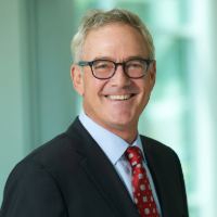 Headshot of Stephen shawler with an office background. Where he is smiling.  
