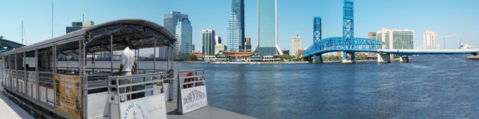 Photo of the river with a ferry boat and landscape of Downtown Jacksonville