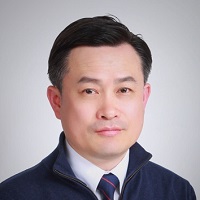 Headshot of Dong-Young Kim with a blue jacket and blue tie