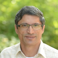 Headshot of Rahul W Kale wearing glasses and a white collared shirt