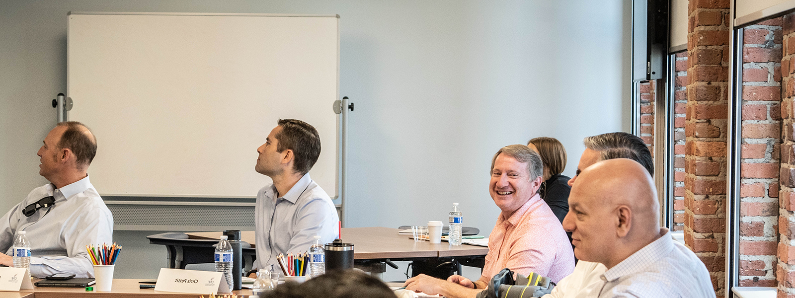 Executives smiling in a group setting