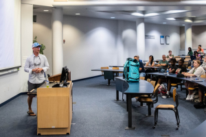 Steve Elder talking to classroom of students