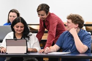 Nilufer talking to students in class