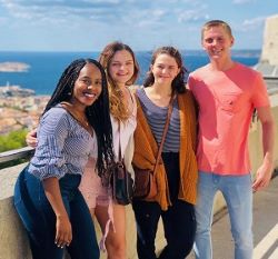 Four students smiling 