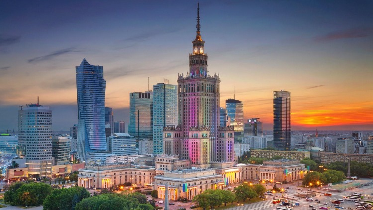 Warsaw city skyline with sunset in background