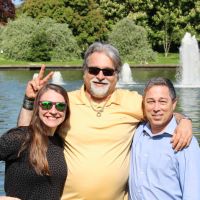 Dr. Azzari, Dr. Fadil, and Prof. Titus in front of a fountain in Ireland