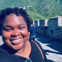 Dr. Burgin smiling on the Great Wall of China