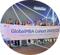group of GlobalMBA students holding a banner at Samsung business visit in South Korea