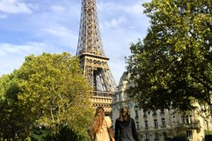 two UNF students looking at the Eiffel Tower