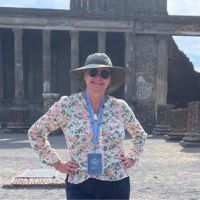 Dr. Gordon in front of ruins in Pompeii