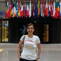 Dr. Ozdemir abroad with international flags in the background