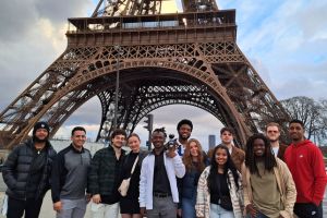 group of UNF students in front of Eiffel Tower
