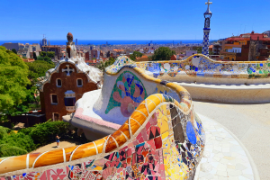 Colorful tile wall in foreground with city and ocean in the background