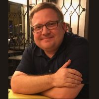 Dr. Triplett in a cafe abroad