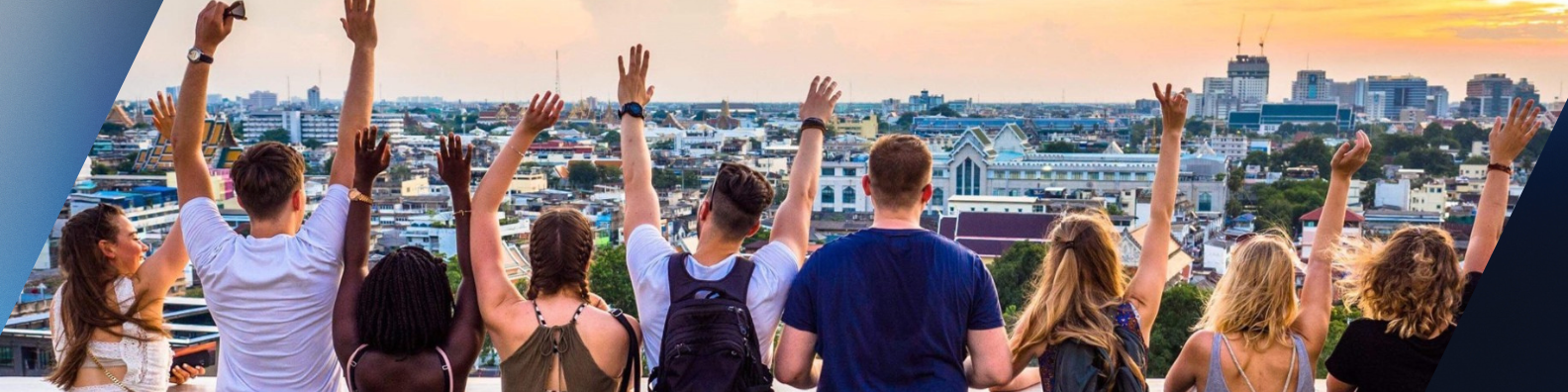 a group of UNF students abroad overlooking a city at sunset