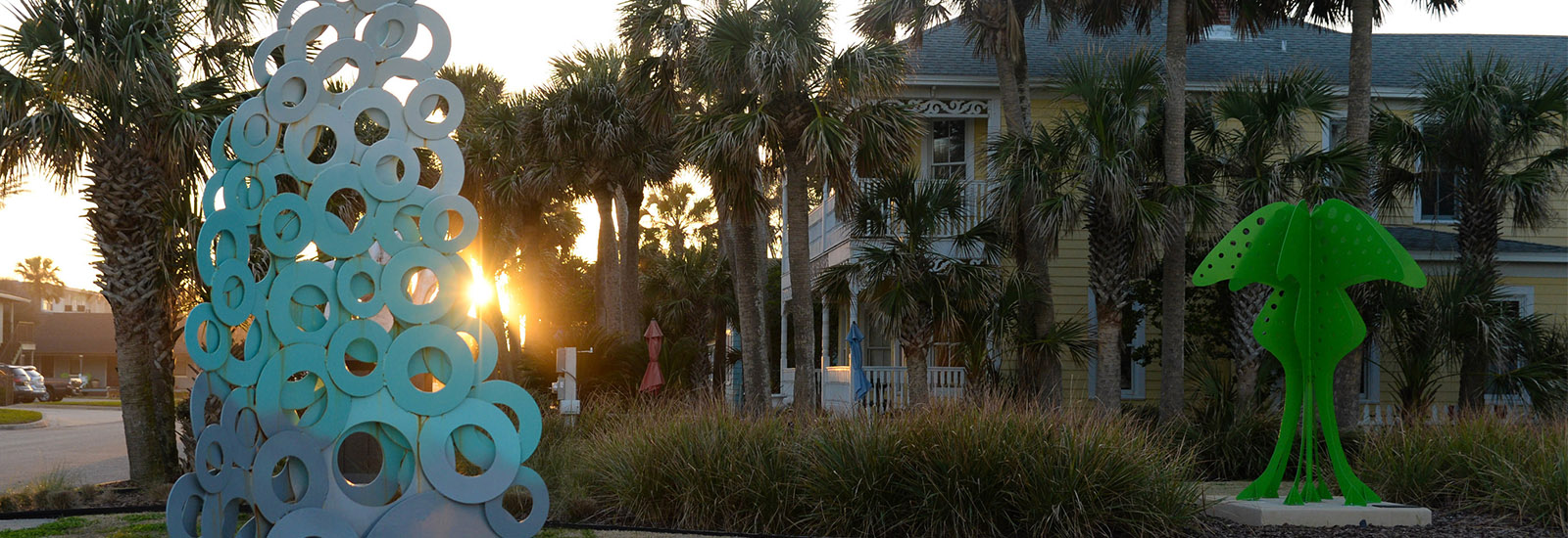 Sun shining through sculptures on display at the UNF Seaside Sculpture Park in Jacksonville Beach