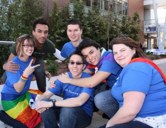 Group of people wearing rainbow merchandise