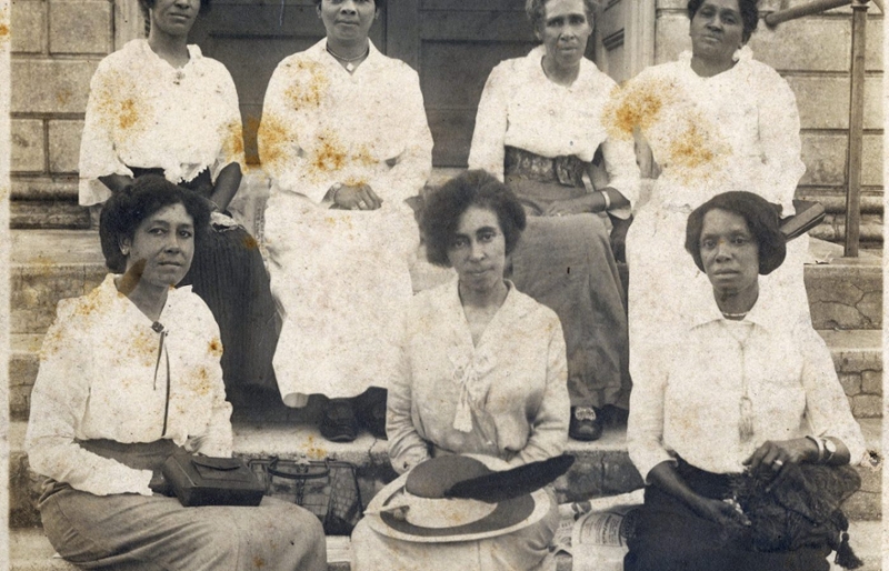 women sitting on a porch