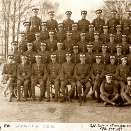 sepia colored soldiers posing in rows 