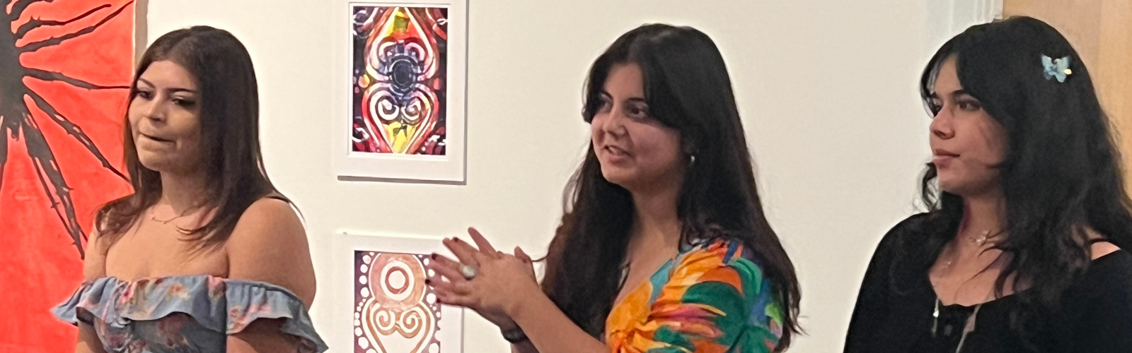 Three students in a gallery of art