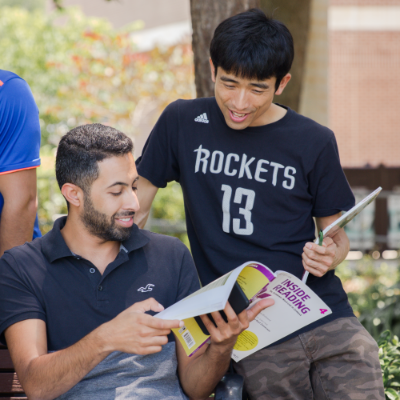 Students on campus reading