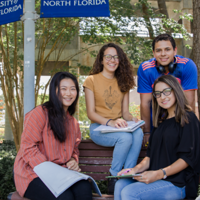 Students on campus smiling