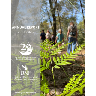 Cover of 2024-2025 annual report for IERE with individuals walking in nature.