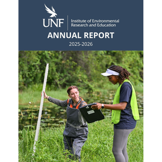 Two students conducting environmental research data measurements