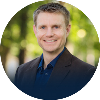 Headshot of Dr. Matthew Browning with blurred nature background.