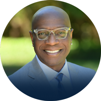 Headshot of Dr. Richmond Wynn with blurred nature background.