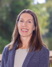 Headshot of Kathleen Hutton with nature background