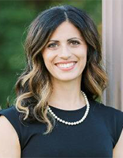Headshot photo of Dr. Adrien Malek-Lasater standing outside.