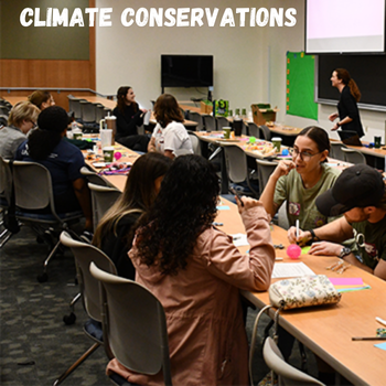 Students sitting at classroom tables conversing with the text of climate conversations written on the top left of the photo.