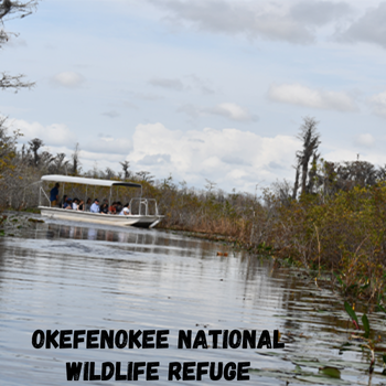 A boat in water with the location of Okefenokee National Wildlife Refuge written on the bottom of the photo.