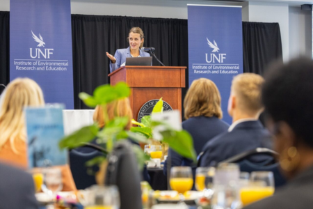 IERE Director Erin Largo-Wight at podium
