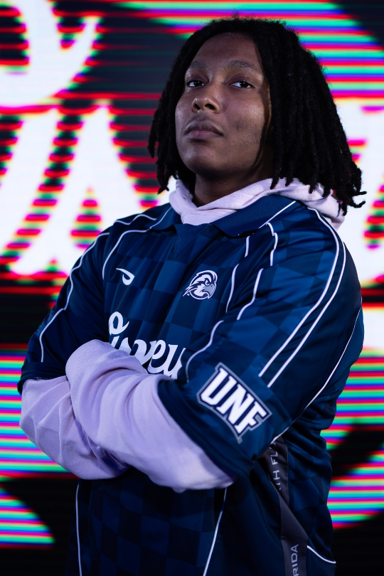 Necoli Stephenson for Fighting Games Varsity wearing a UNF Esports jersey